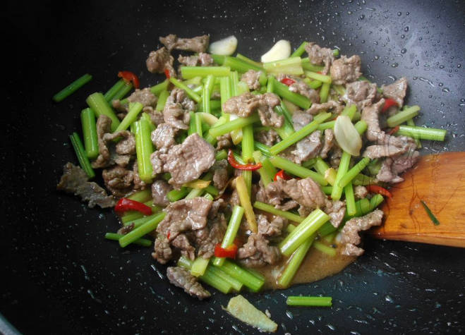 Finally, add beef and green onion and stir-fry well, add salt and soy sauce to taste and serve