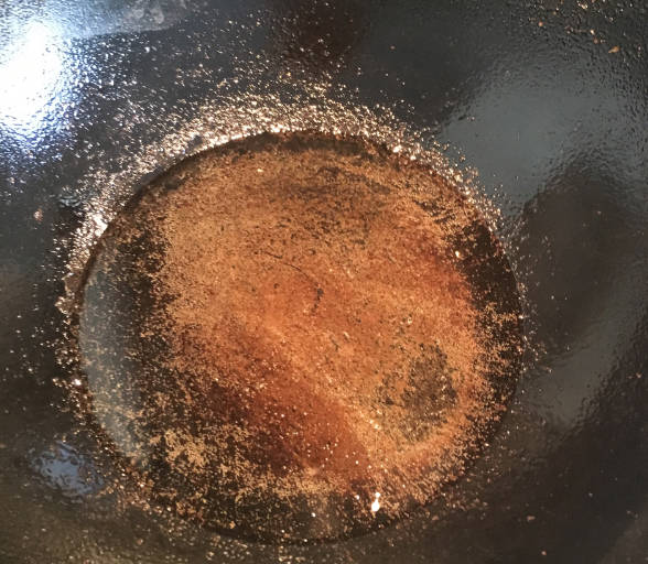 Heat oil in a pan until it smokes a little